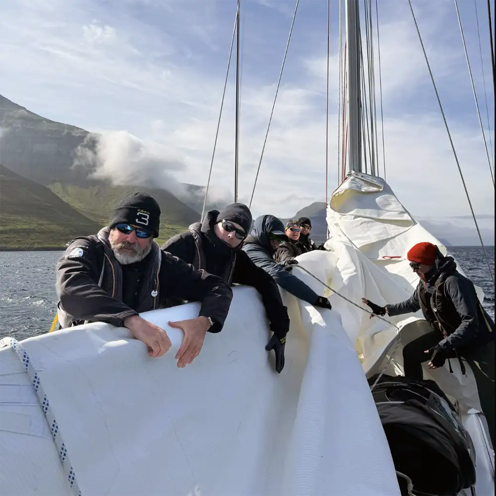 crew flaking mainsail