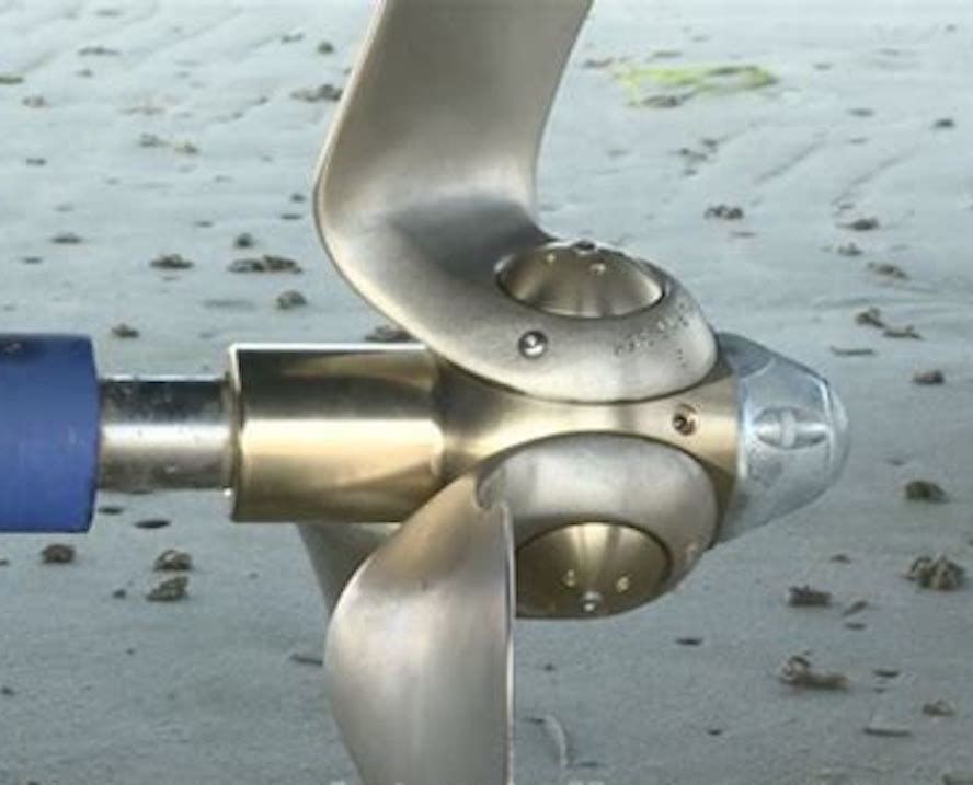 Close-up of a three-bladed boat propeller.